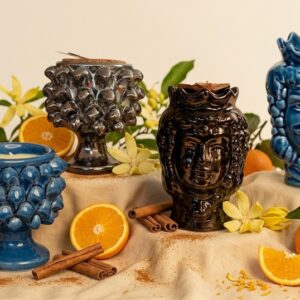Candele Happy di Elisir di Luce in Testa di Moro e Mezza Pigna, colori Bronzo Lucido e Blu Cristallino