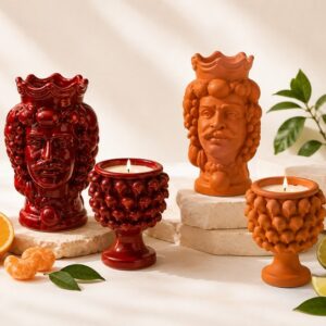 Candele Profumi di Sicilia di Elisir di Luce in Testa di Moro e Mezza Pigna, colori Rosso Lucido e Arancio Opaco
